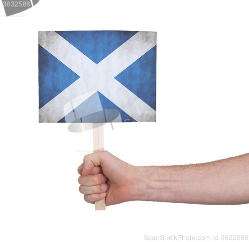 Image of Hand holding small card - Flag of Scotland