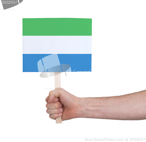 Image of Hand holding small card - Flag of Sierra Leone