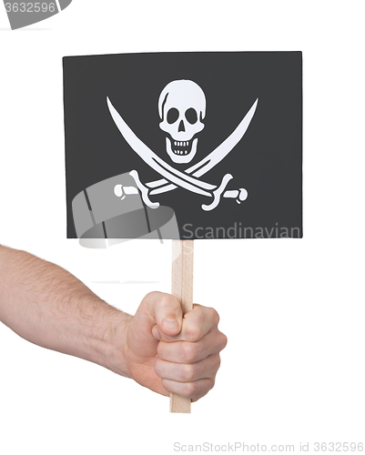 Image of Hand holding small card - Flag of Pirate