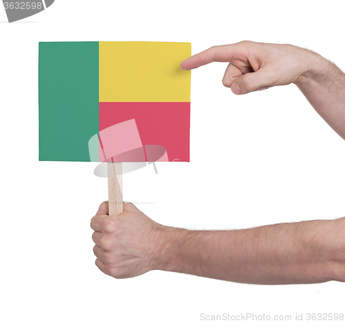 Image of Hand holding small card - Flag of Benin