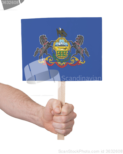 Image of Hand holding small card - Flag of Pennsylvania