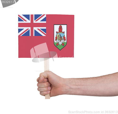 Image of Hand holding small card - Flag of Bermuda