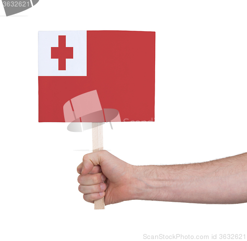 Image of Hand holding small card - Flag of Tonga