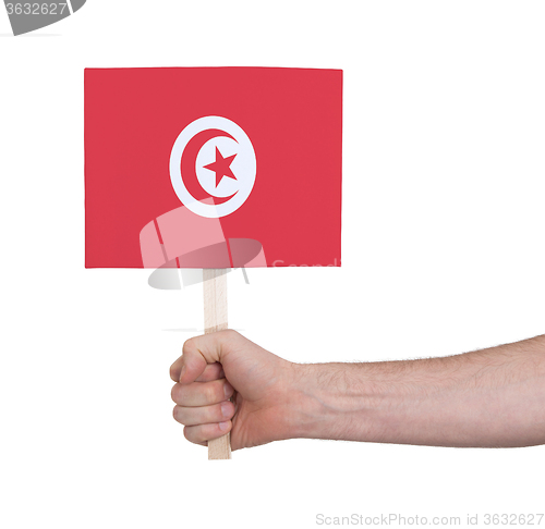 Image of Hand holding small card - Flag of Tunisia