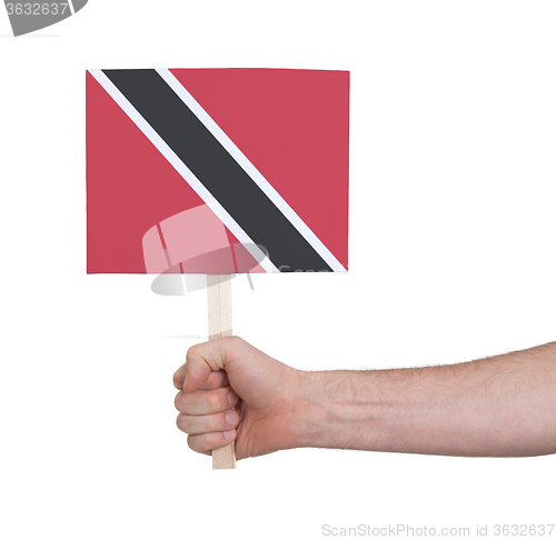 Image of Hand holding small card - Flag of Trinidad and Tobago