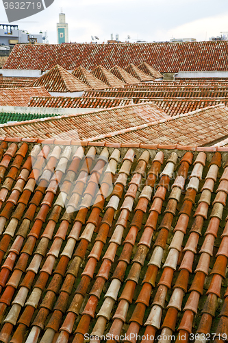 Image of minaret     tile roof in the old city 