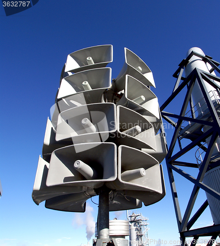 Image of Isolated loudspeakers with a natural blue background  