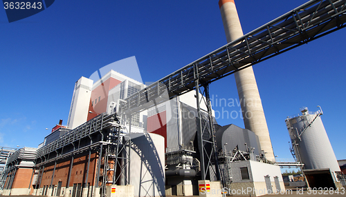 Image of Modern industrial factory against blue sky