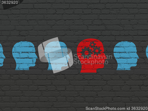 Image of Business concept: head with gears icon on wall background