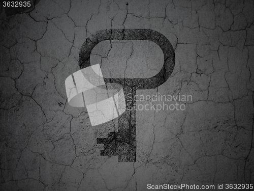 Image of Safety concept: Key on grunge wall background