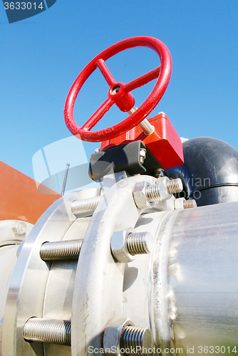 Image of Industrial zone, Steel pipelines and valves against blue sky