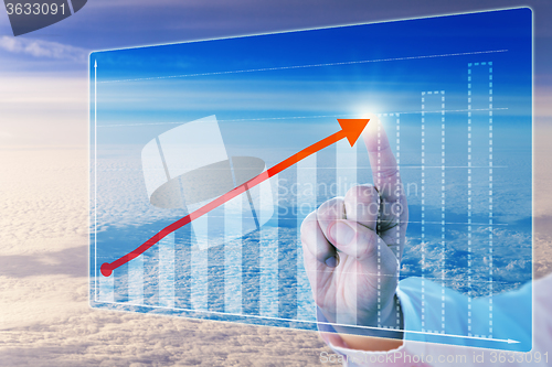 Image of Finger Touching Growth Arrow In Forecasting Chart