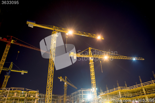 Image of cranes and illumination at night