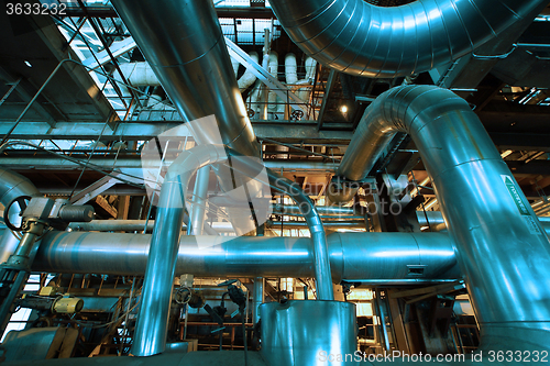 Image of Industrial zone, Steel pipelines and equipment in blue tone