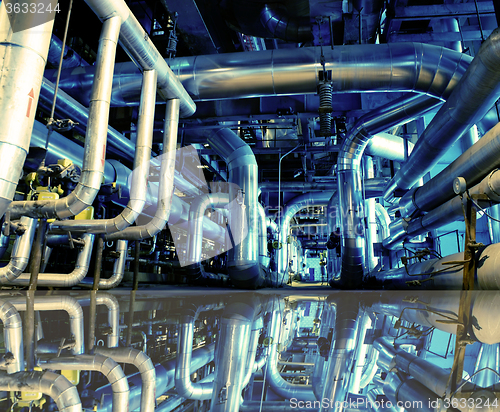 Image of Industrial zone, Steel pipelines in blue tones with reflection