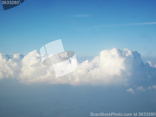 Image of blue sky and clouds from plane