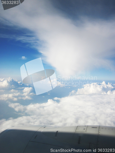 Image of blue sky and clouds from plane