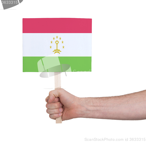 Image of Hand holding small card - Flag of Tajikistan