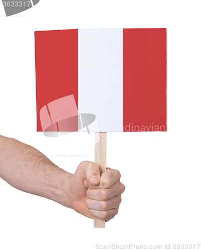 Image of Hand holding small card - Flag of Peru