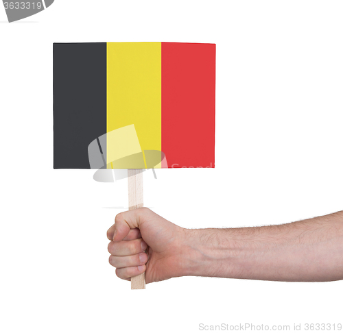 Image of Hand holding small card - Flag of Belgium