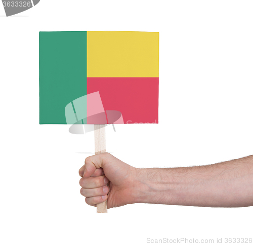 Image of Hand holding small card - Flag of Benin