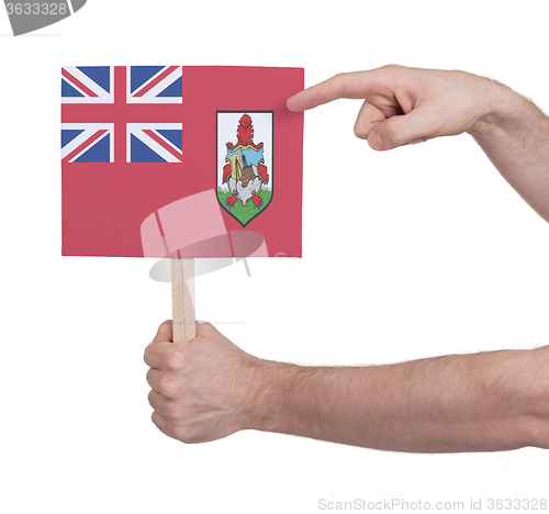 Image of Hand holding small card - Flag of Bermuda