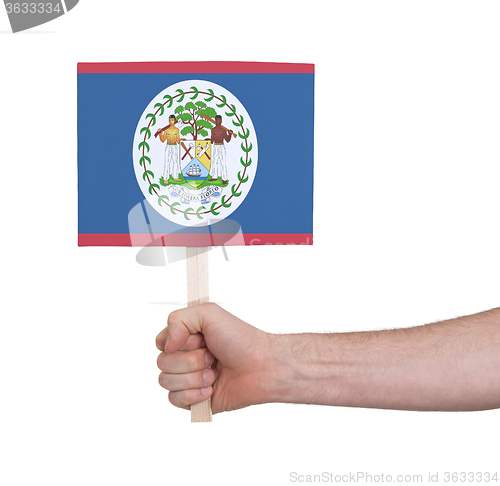 Image of Hand holding small card - Flag of Belize