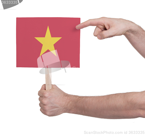 Image of Hand holding small card - Flag of Vietnam