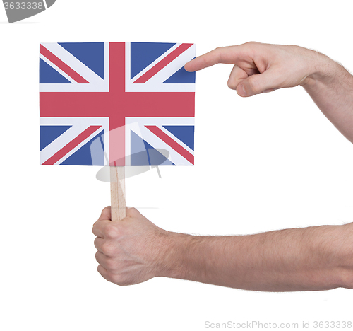 Image of Hand holding small card - Flag of the UK