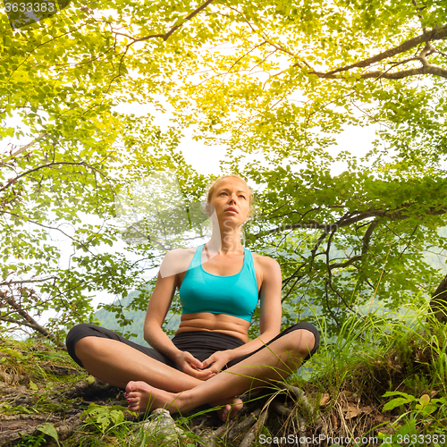 Image of Woman relaxing in beautiful nature.