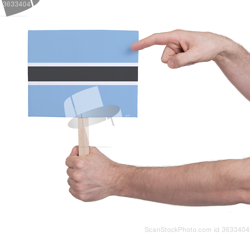 Image of Hand holding small card - Flag of Botswana