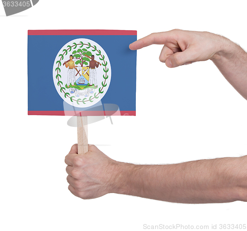 Image of Hand holding small card - Flag of Belize