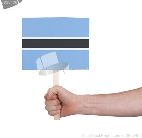 Image of Hand holding small card - Flag of Botswana