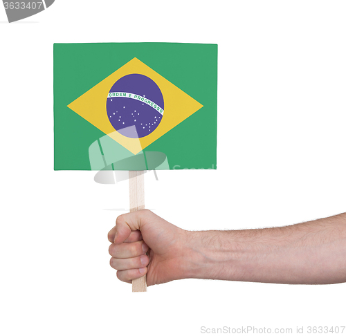 Image of Hand holding small card - Flag of Brazil