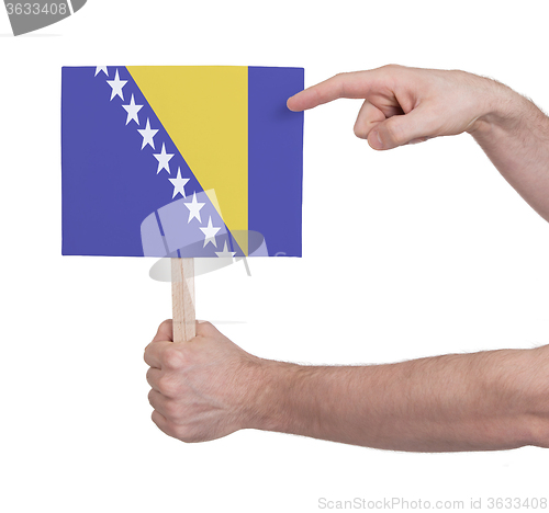 Image of Hand holding small card - Flag of Bosnia Herzegovina