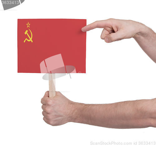 Image of Hand holding small card - Flag of the USSR