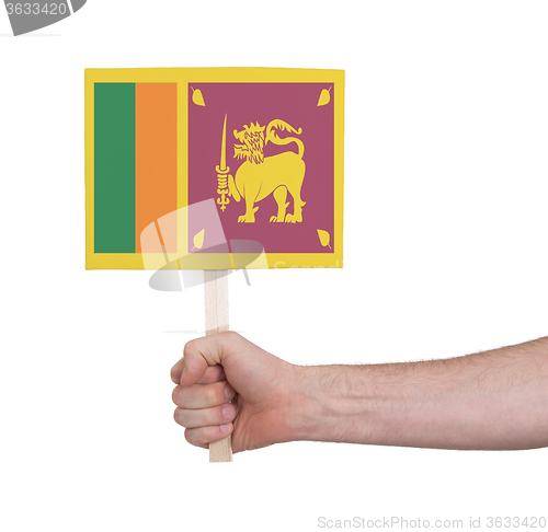 Image of Hand holding small card - Flag of Sri Lanka