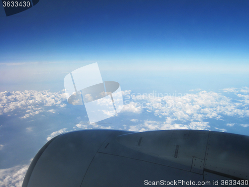 Image of blue sky and clouds from plane