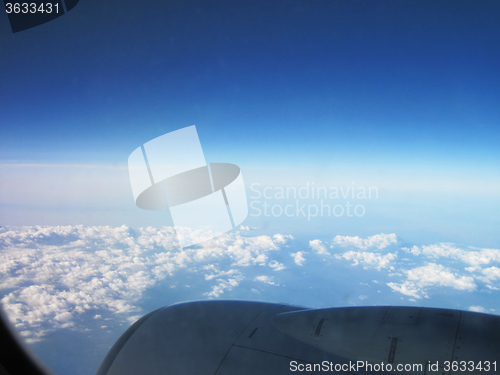 Image of blue sky and clouds from plane