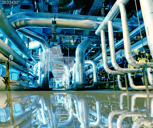 Image of Industrial zone, Steel pipelines in blue tones with reflection