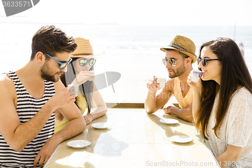 Image of Friends at the beach bar