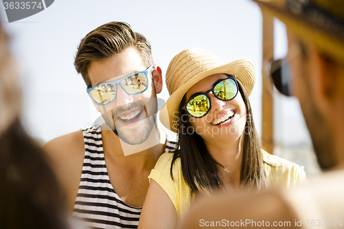 Image of Friends at the beach bar