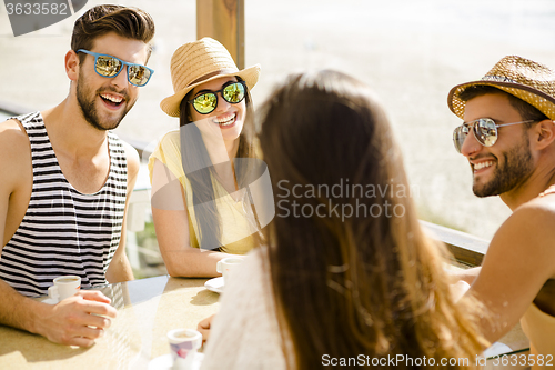 Image of Friends at the beach bar