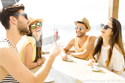 Image of Friends at the beach bar