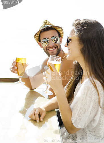 Image of Friends drinking a cold beer