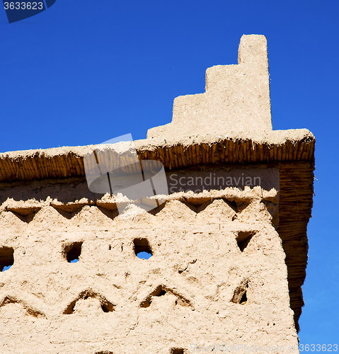 Image of brown old  construction in  africa morocco and  clouds  near the