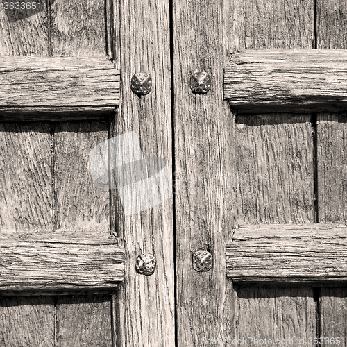 Image of door in italy old ancian wood and trasditional  texture nail