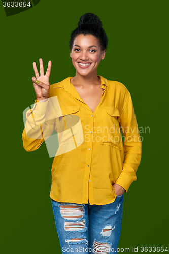 Image of Woman showing three fingers