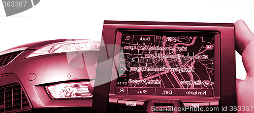 Image of GPS Vehicle navigation system in a man hand.