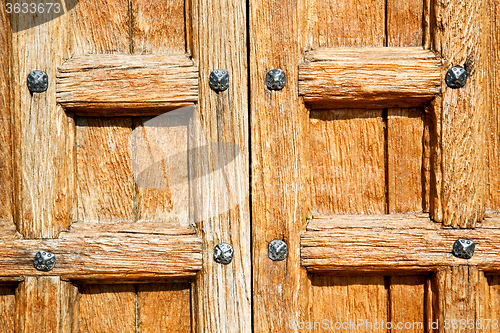 Image of door in italy old ancian wood   texture nail